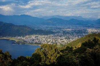 A colour photo of an overview of the city of Pokhara, Nepal, taken from a nearby mountaintop.