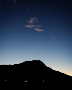 Silhouette of Diamond Head against the sky with Mercury shining above