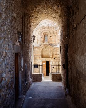 A passage leading to the entrance of a small church