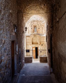A passage leading to the entrance of a small church