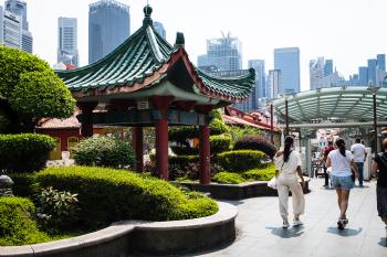 An overpass in chinatown, with trees