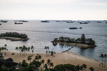 Ships, with Siloso beach in the foreground